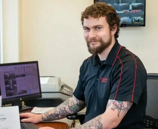 Photo of bearded man in First Choice Self Storage office